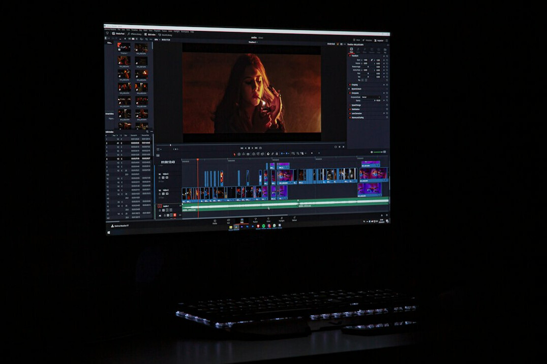 filmmaker editing video on computer